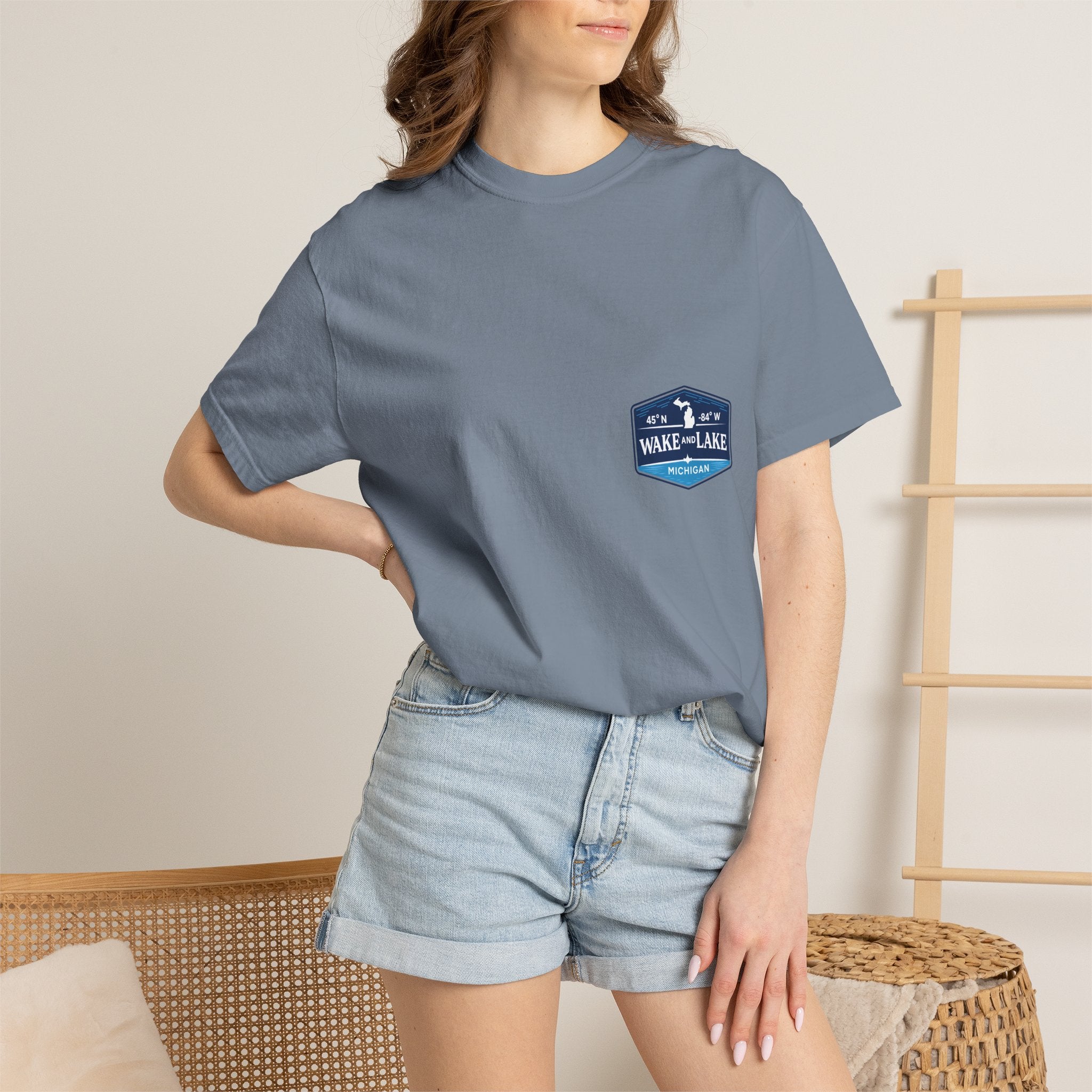 Wake and Lake Michigan Shield Tee worn on a Great Lakes dock
Bold Michigan crest graphic t-shirt for lake life
Michigan boating shirt with Wake and Lake shield logo
Unisex cotton tee with Michigan state pride lake graphic
