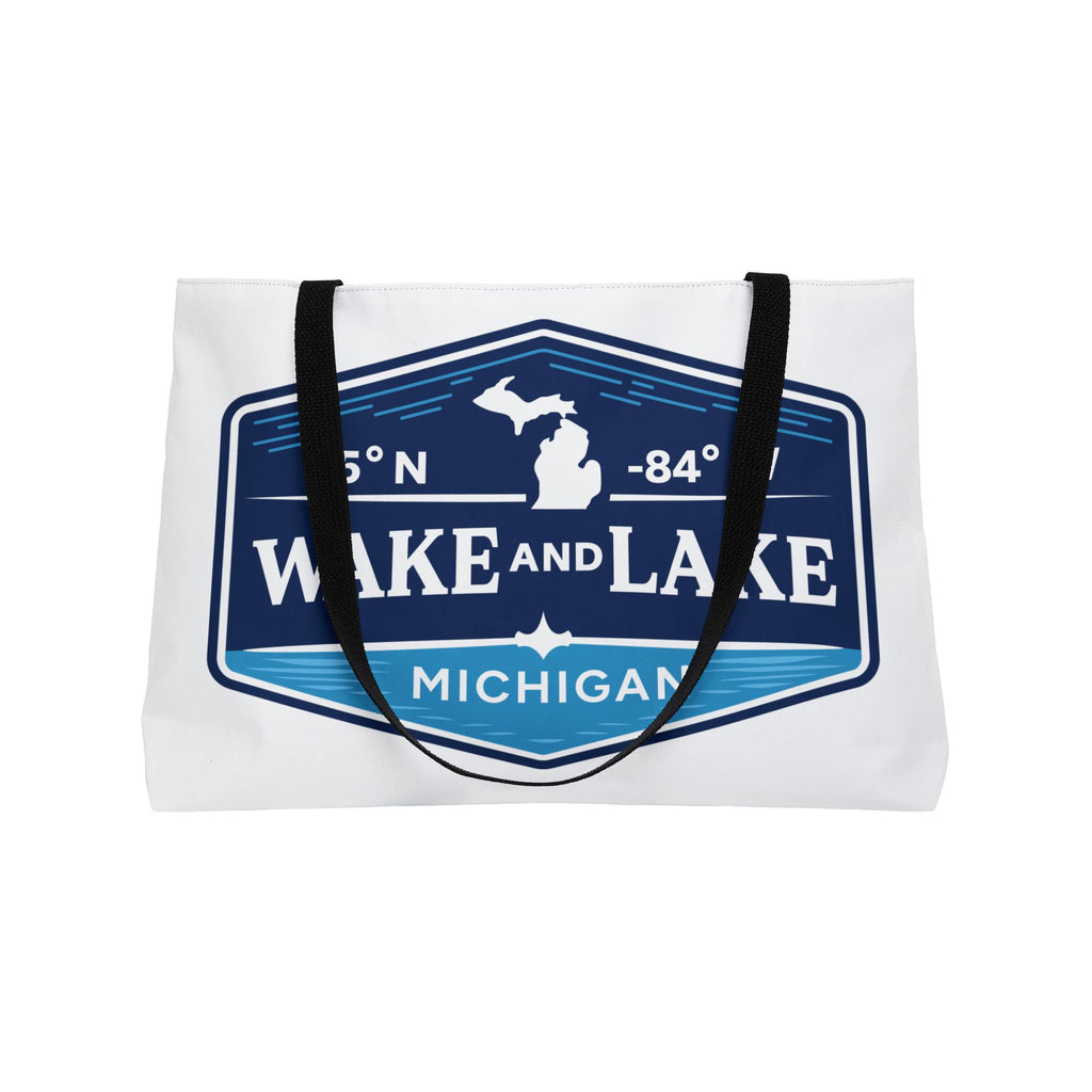 Wake and Lake Michigan Weekender Tote Bag at a Great Lakes dock
Spacious Michigan lake tote bag with shield graphic
Durable Michigan canvas carryall for lake trips and boating
Great Lakes weekend bag with Wake and Lake Michigan branding

