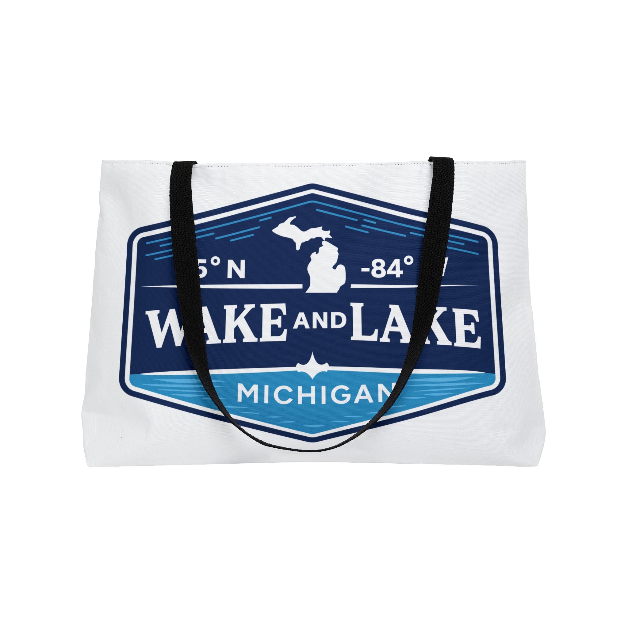 Wake and Lake Michigan Weekender Tote Bag at a Great Lakes dock
Spacious Michigan lake tote bag with shield graphic
Durable Michigan canvas carryall for lake trips and boating
Great Lakes weekend bag with Wake and Lake Michigan branding
