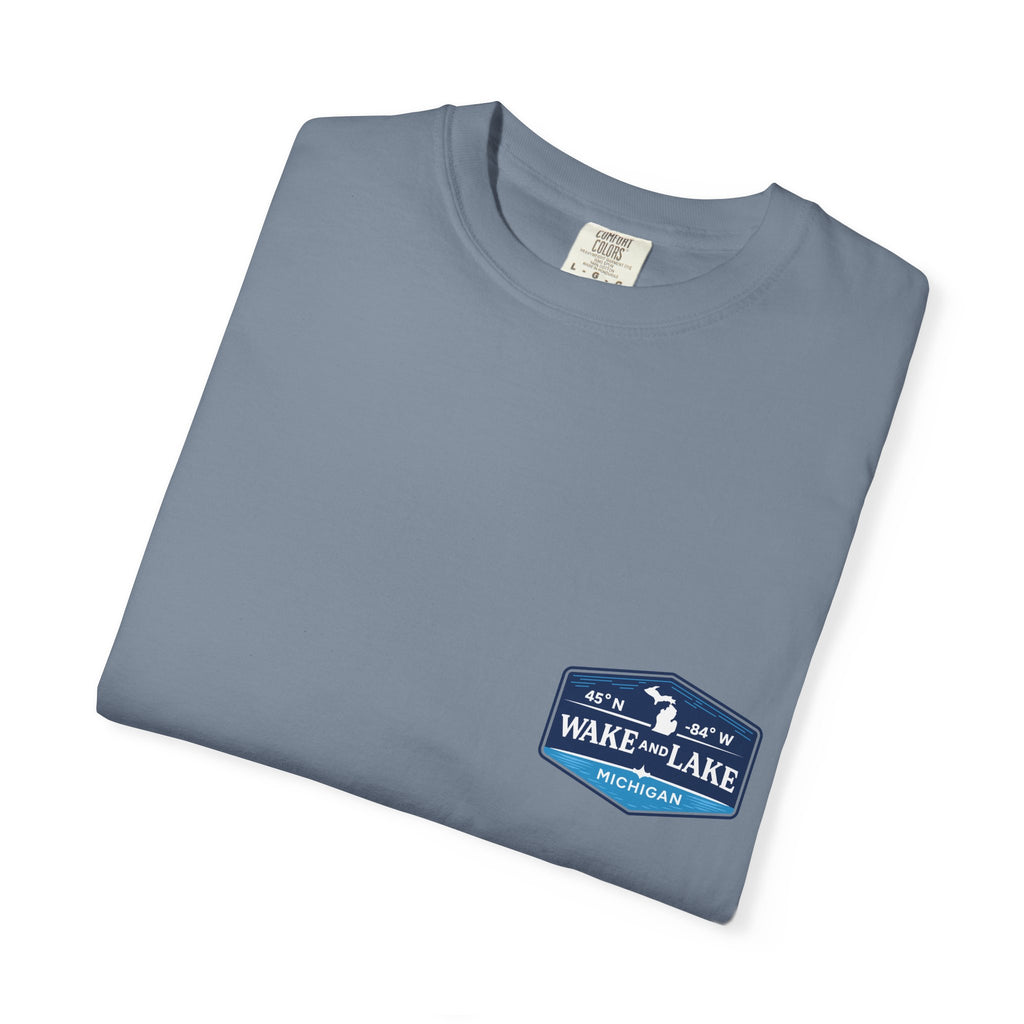 Wake and Lake Michigan Shield Tee worn on a Great Lakes dock
Bold Michigan crest graphic t-shirt for lake life
Michigan boating shirt with Wake and Lake shield logo
Unisex cotton tee with Michigan state pride lake graphic
