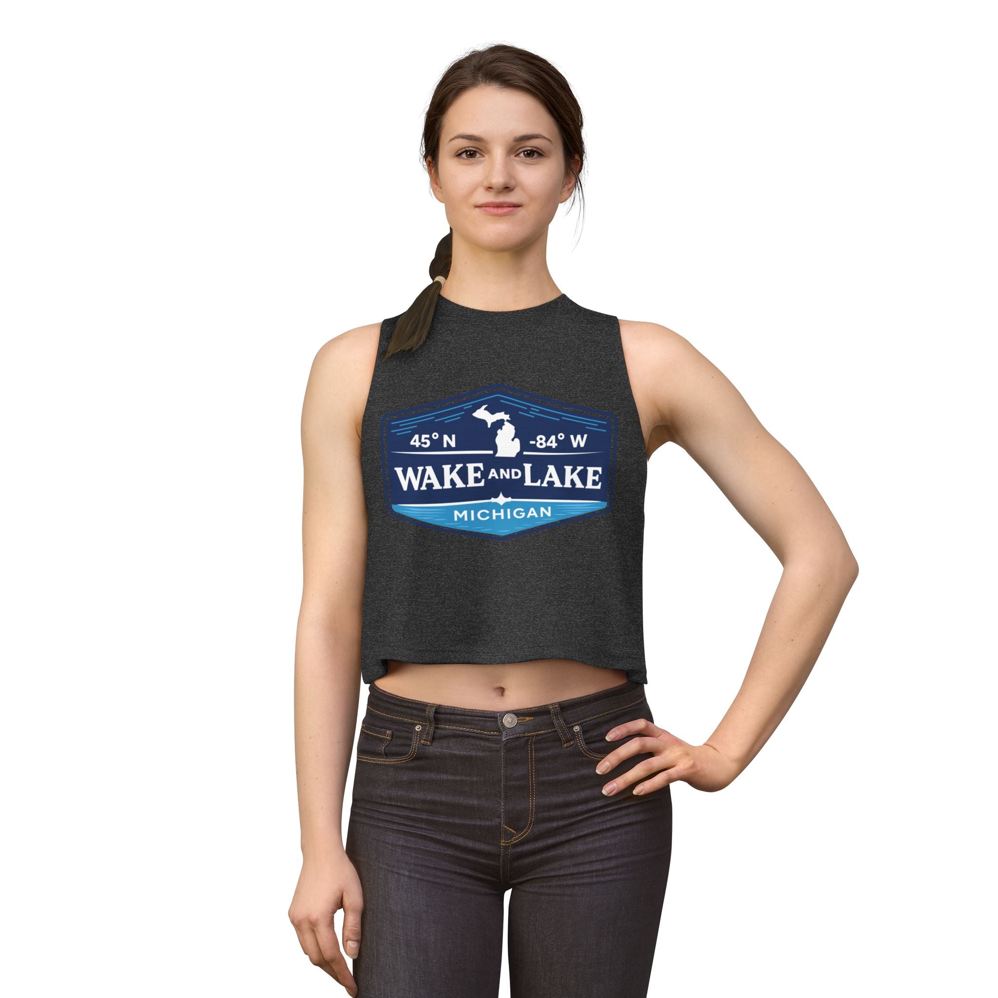 Wake and Lake Michigan Shield Women's Crop Tee – Fitted, sleeveless, black, front view on model.
