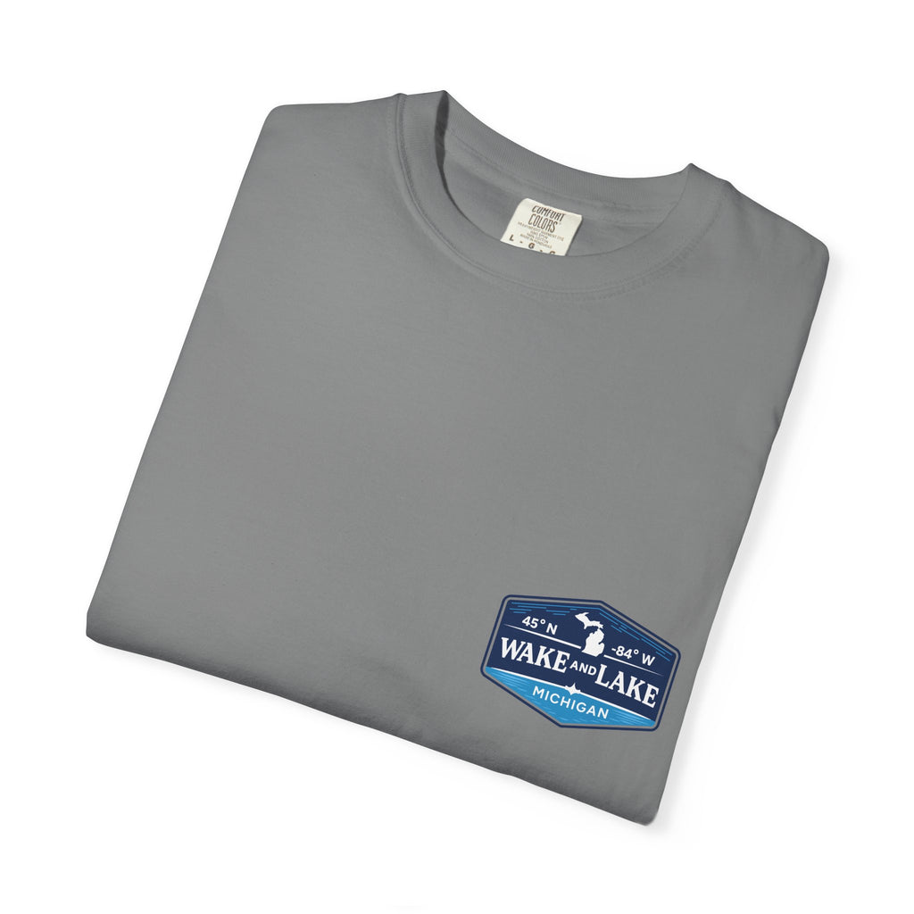 Wake and Lake Michigan Shield Tee worn on a Great Lakes dock
Bold Michigan crest graphic t-shirt for lake life
Michigan boating shirt with Wake and Lake shield logo
Unisex cotton tee with Michigan state pride lake graphic
