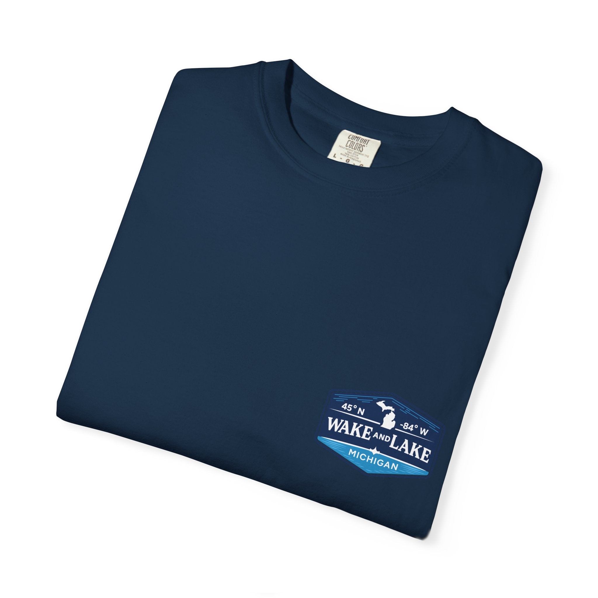 Wake and Lake Michigan Shield Tee worn on a Great Lakes dock
Bold Michigan crest graphic t-shirt for lake life
Michigan boating shirt with Wake and Lake shield logo
Unisex cotton tee with Michigan state pride lake graphic
