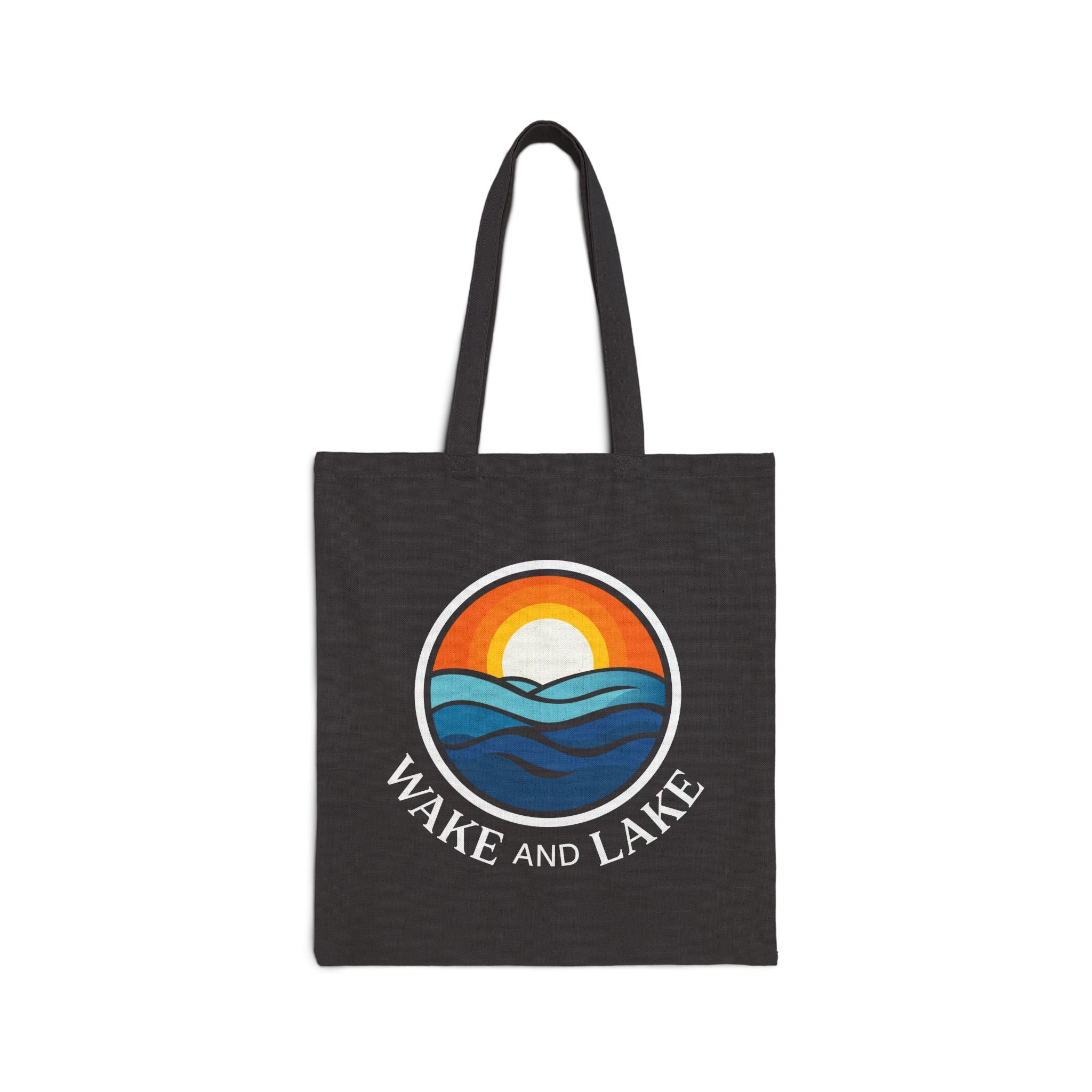 Wake and Lake Michigan Canvas Tote Bag at a Great Lakes shoreline
Michigan shield canvas carryall tote for lake days
Durable Michigan lake bag with Wake and Lake branding
Great Lakes canvas tote bag with Michigan shield graphic
