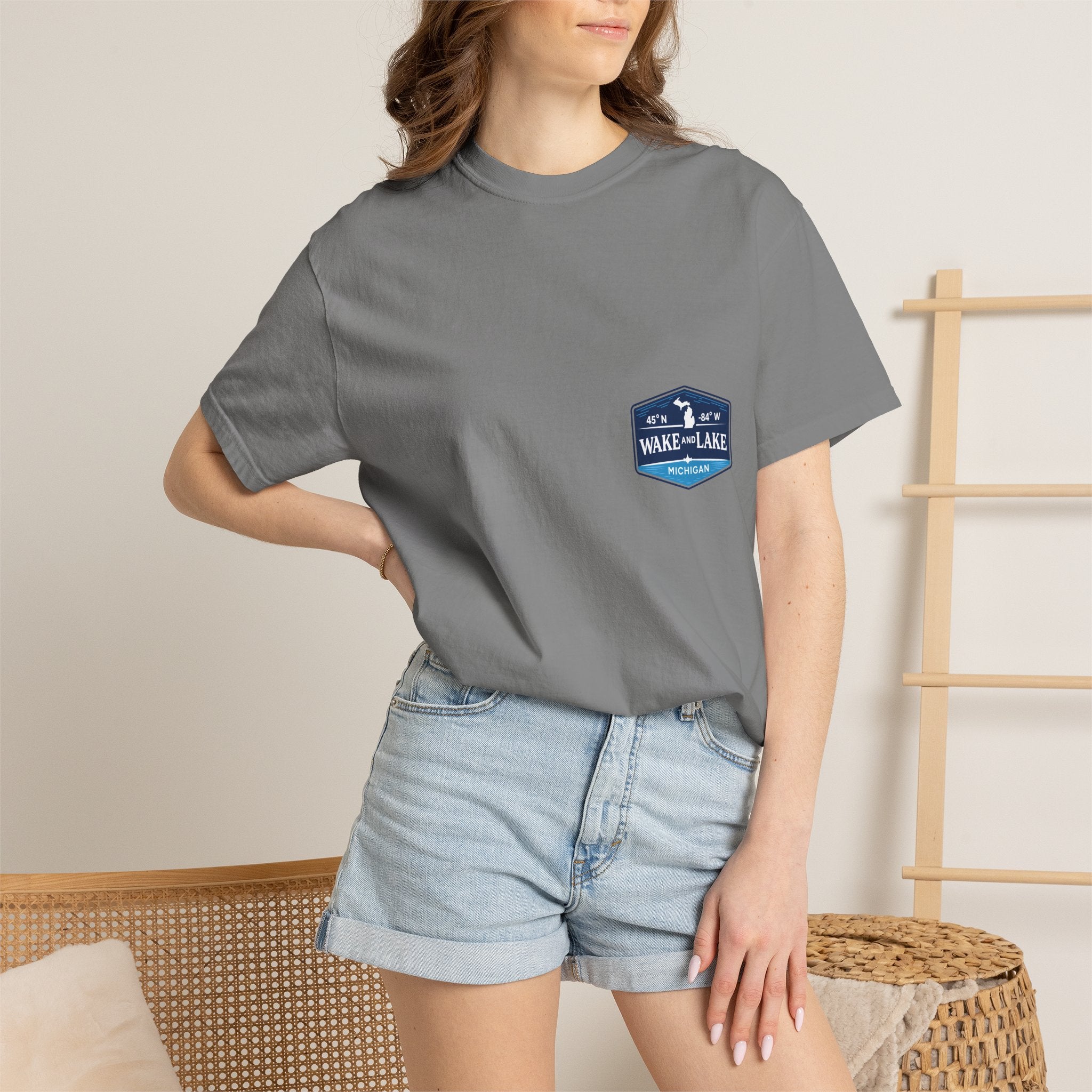 Wake and Lake Michigan Shield Tee worn on a Great Lakes dock
Bold Michigan crest graphic t-shirt for lake life
Michigan boating shirt with Wake and Lake shield logo
Unisex cotton tee with Michigan state pride lake graphic
