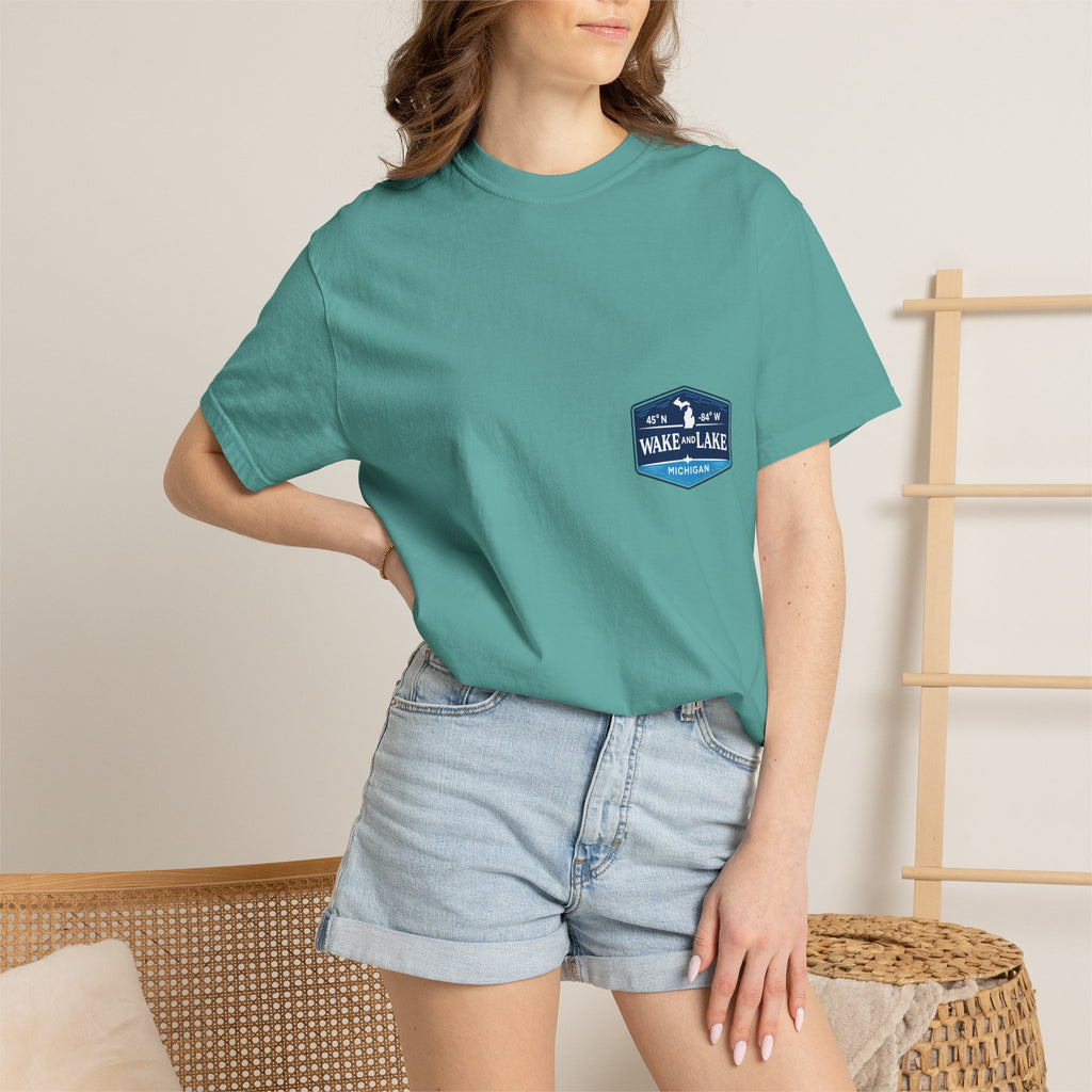 Wake and Lake Michigan Shield Tee worn on a Great Lakes dock
Bold Michigan crest graphic t-shirt for lake life
Michigan boating shirt with Wake and Lake shield logo
Unisex cotton tee with Michigan state pride lake graphic
