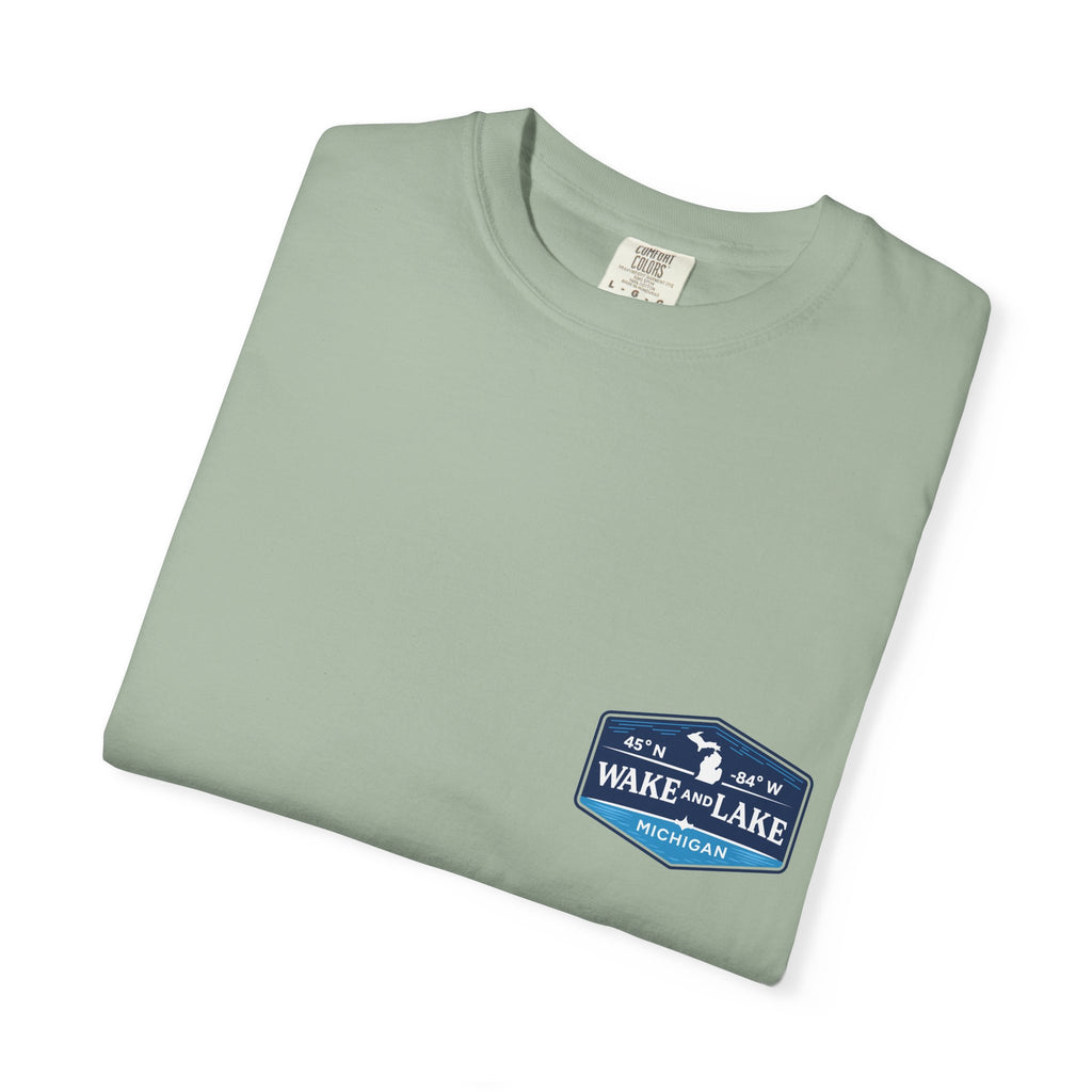 Wake and Lake Michigan Shield Tee worn on a Great Lakes dock
Bold Michigan crest graphic t-shirt for lake life
Michigan boating shirt with Wake and Lake shield logo
Unisex cotton tee with Michigan state pride lake graphic
