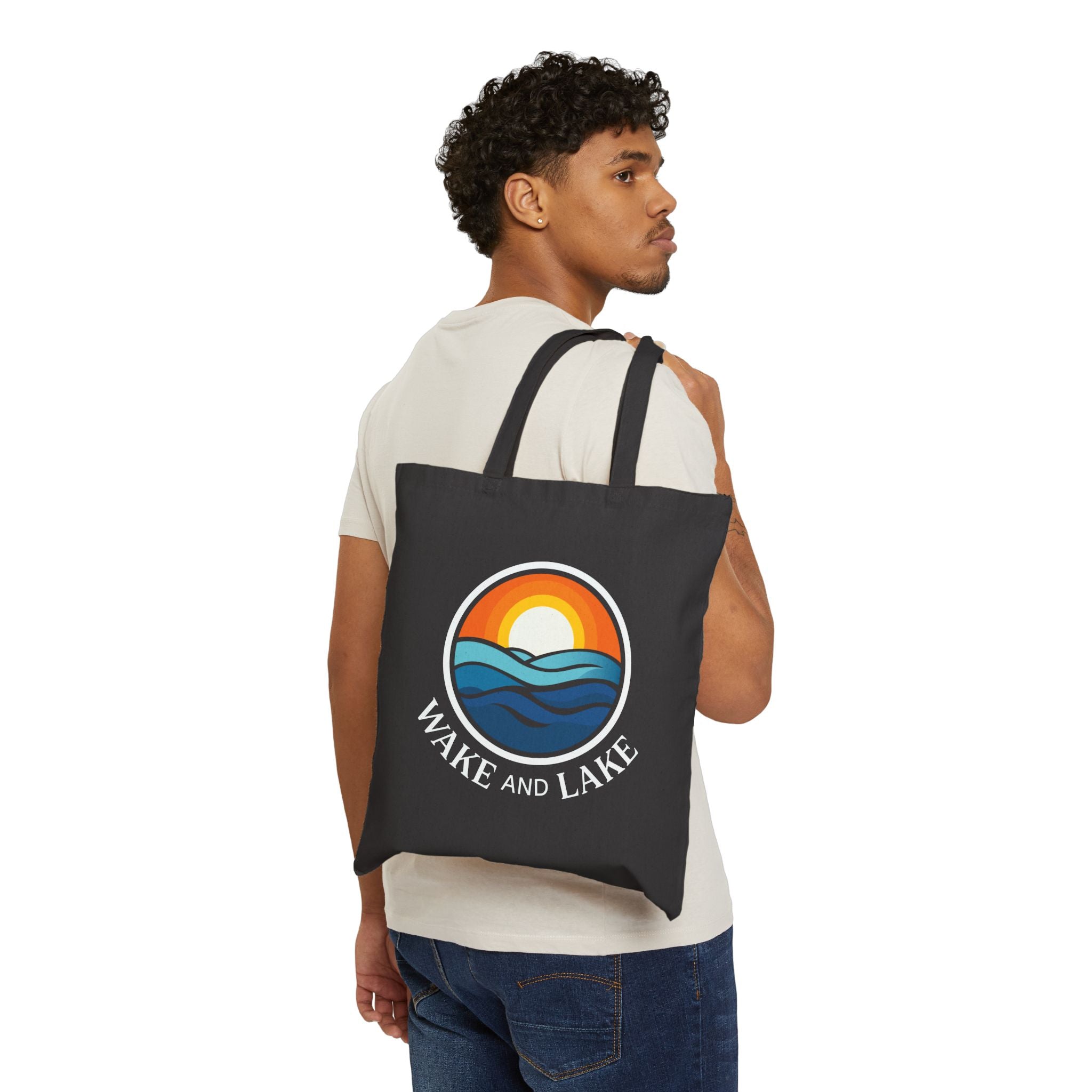 Wake and Lake Michigan Canvas Tote Bag at a Great Lakes shoreline
Michigan shield canvas carryall tote for lake days
Durable Michigan lake bag with Wake and Lake branding
Great Lakes canvas tote bag with Michigan shield graphic
