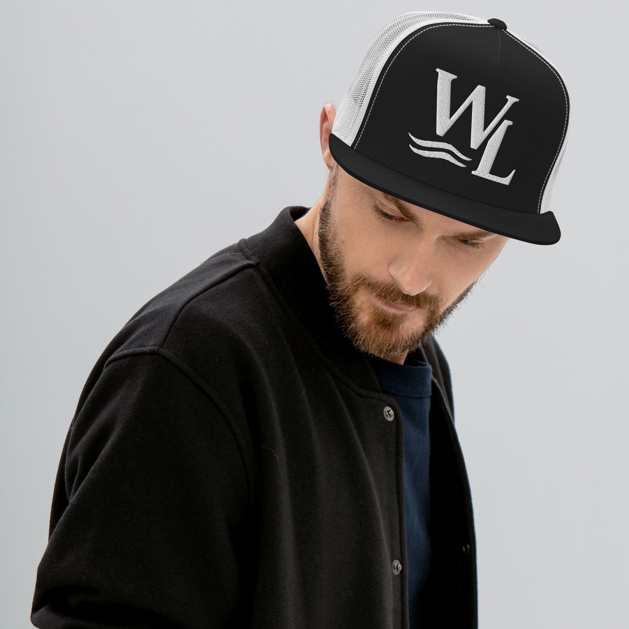 Wake and Lake WL Monogram Trucker Hat worn on a boat at sunrise
Breathable mesh trucker cap with WL monogram for lake life
Adjustable lake trucker hat with Wake and Lake branding
Classic snapback mesh hat with WL logo for boating
