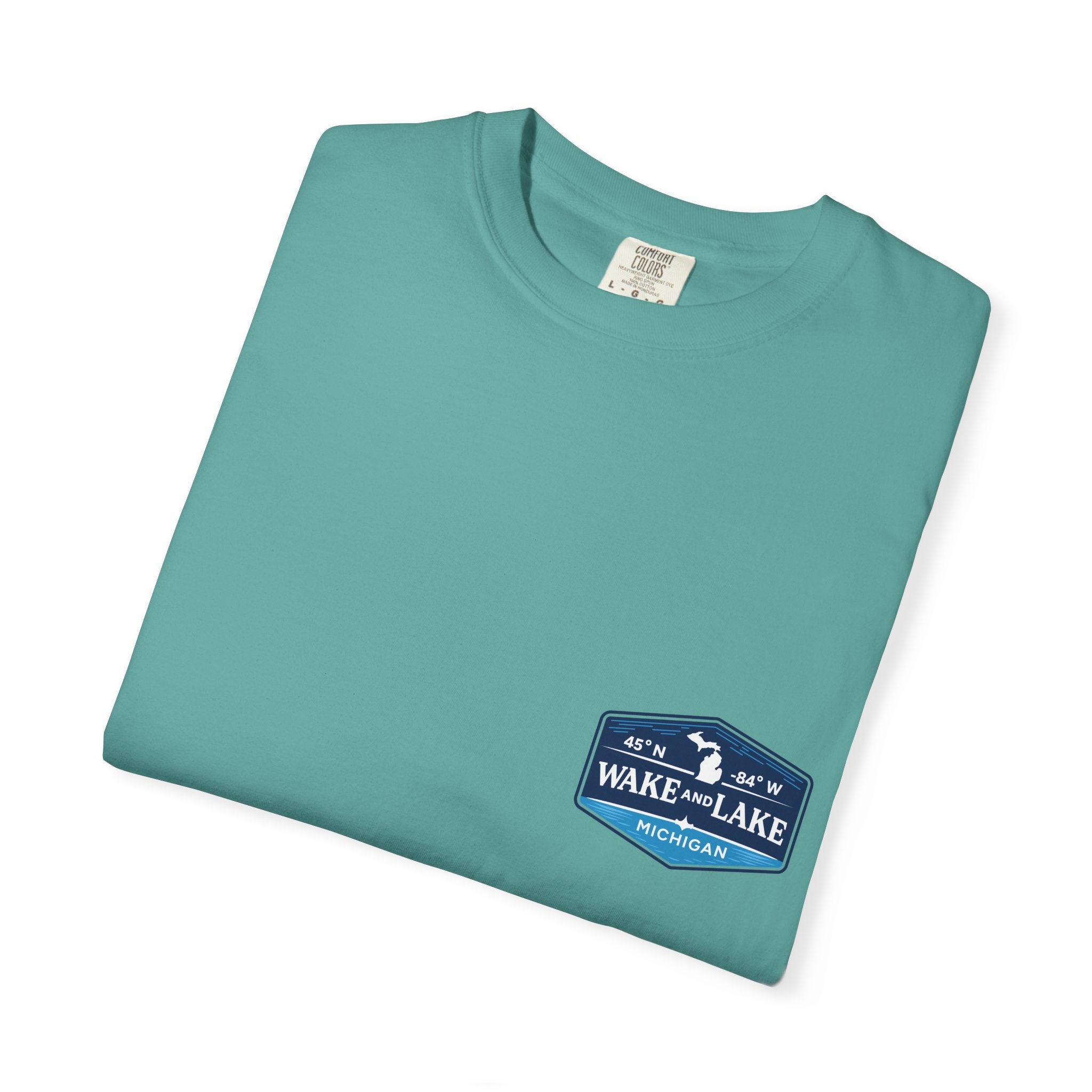 Wake and Lake Michigan Shield Tee worn on a Great Lakes dock
Bold Michigan crest graphic t-shirt for lake life
Michigan boating shirt with Wake and Lake shield logo
Unisex cotton tee with Michigan state pride lake graphic
