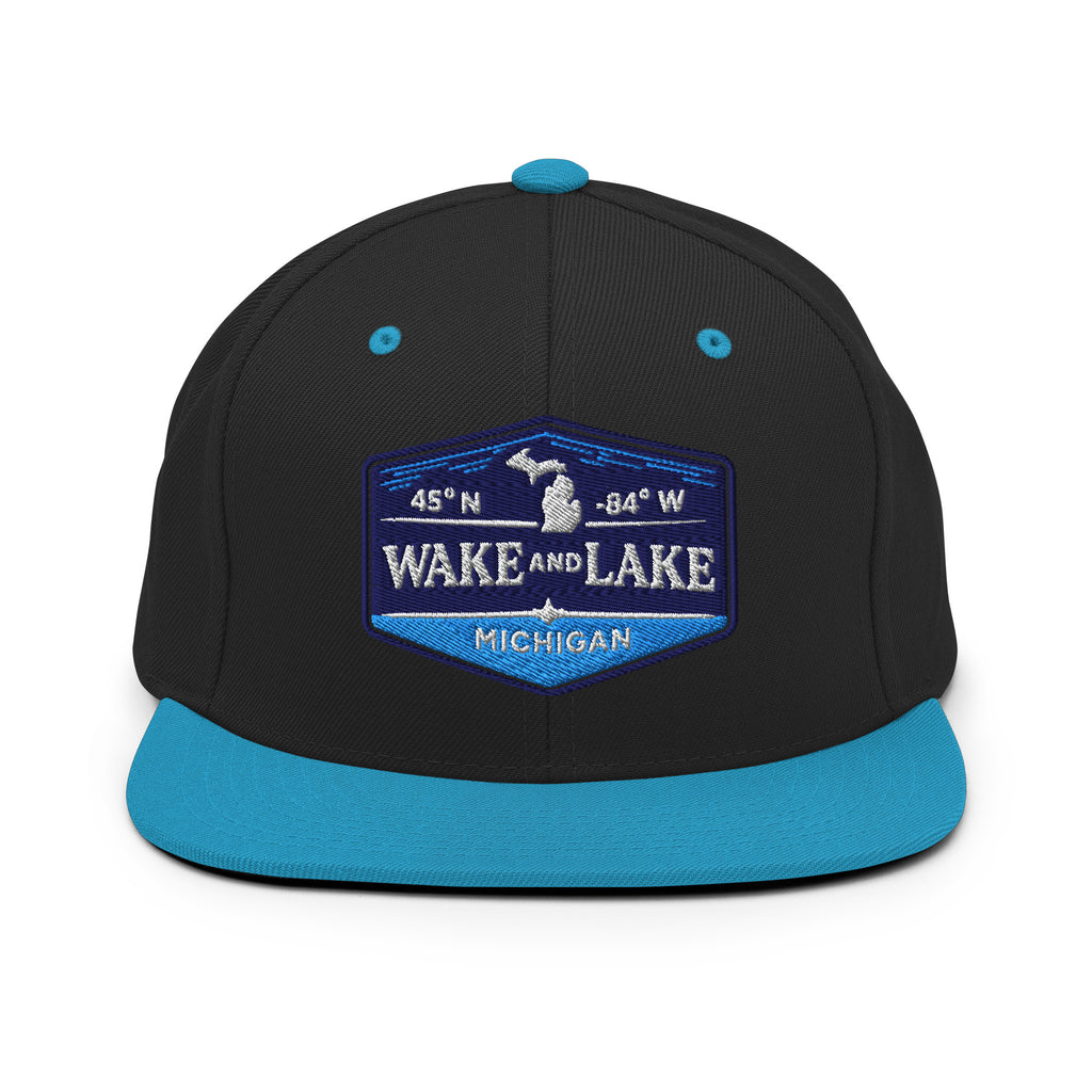 Classic Snap Back Hat, Wake and Lake Coordinate Badge, black and teal, front view