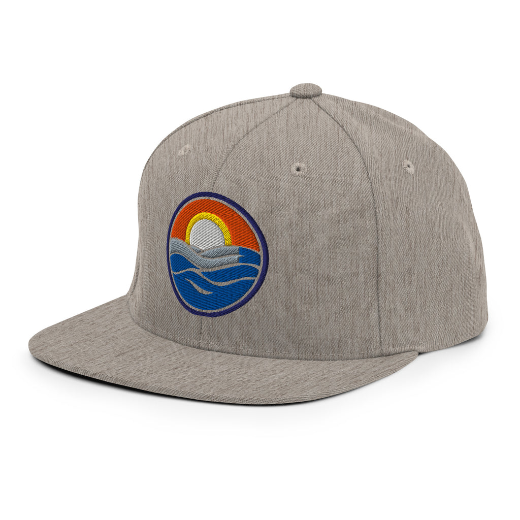 Wake and Lake Circle Crest Snapback Hat worn backwards on a lake boat
Structured snapback lake life hat with circle crest embroidery
Boating snapback cap with Wake and Lake branding
Adjustable circle crest hat for summer lake days
