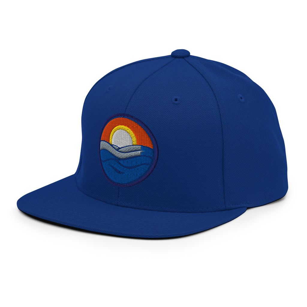 Wake and Lake Circle Crest Snapback Hat worn backwards on a lake boat
Structured snapback lake life hat with circle crest embroidery
Boating snapback cap with Wake and Lake branding
Adjustable circle crest hat for summer lake days
