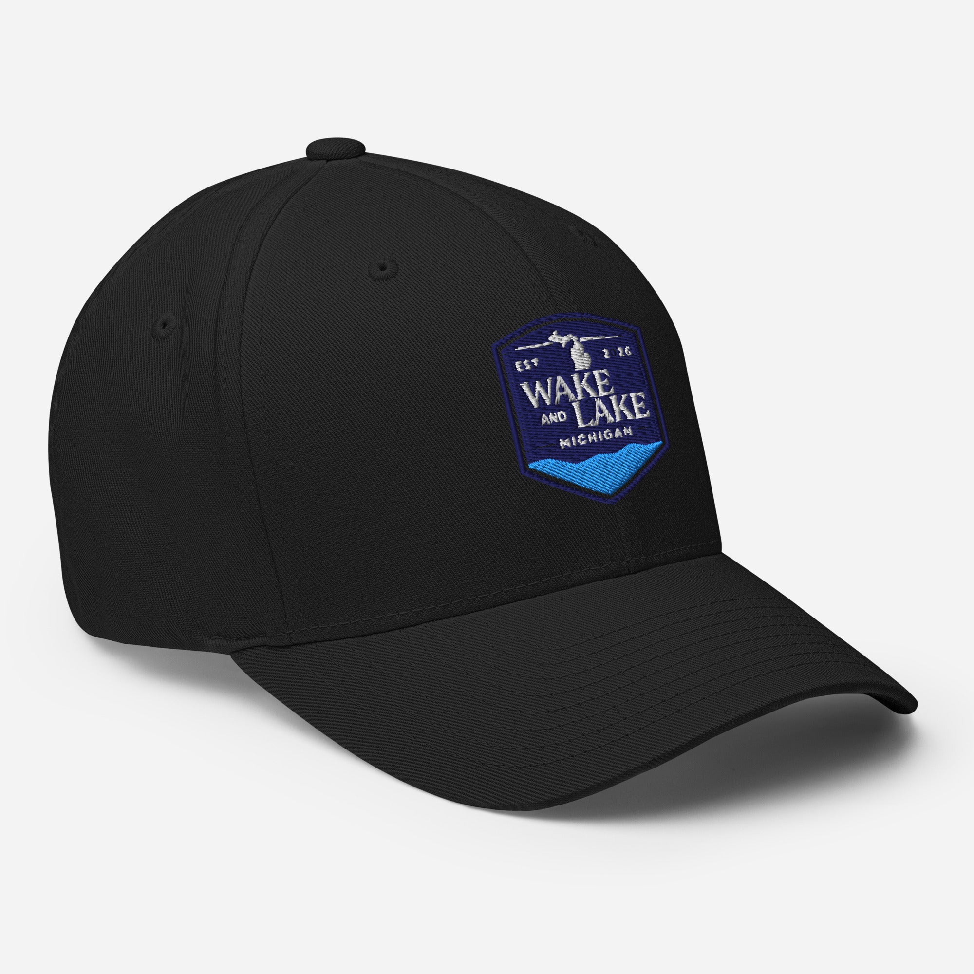 Wake and Lake Michigan Shield FlexFit Hat, Black with Coordinate badge on the front, and Circle Crest logo on the back, front view