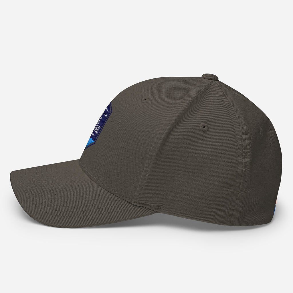 Wake and Lake Michigan Shield FlexFit Hat, dark grey with Coordinate badge on the front, and Circle Crest logo on the back, side  view