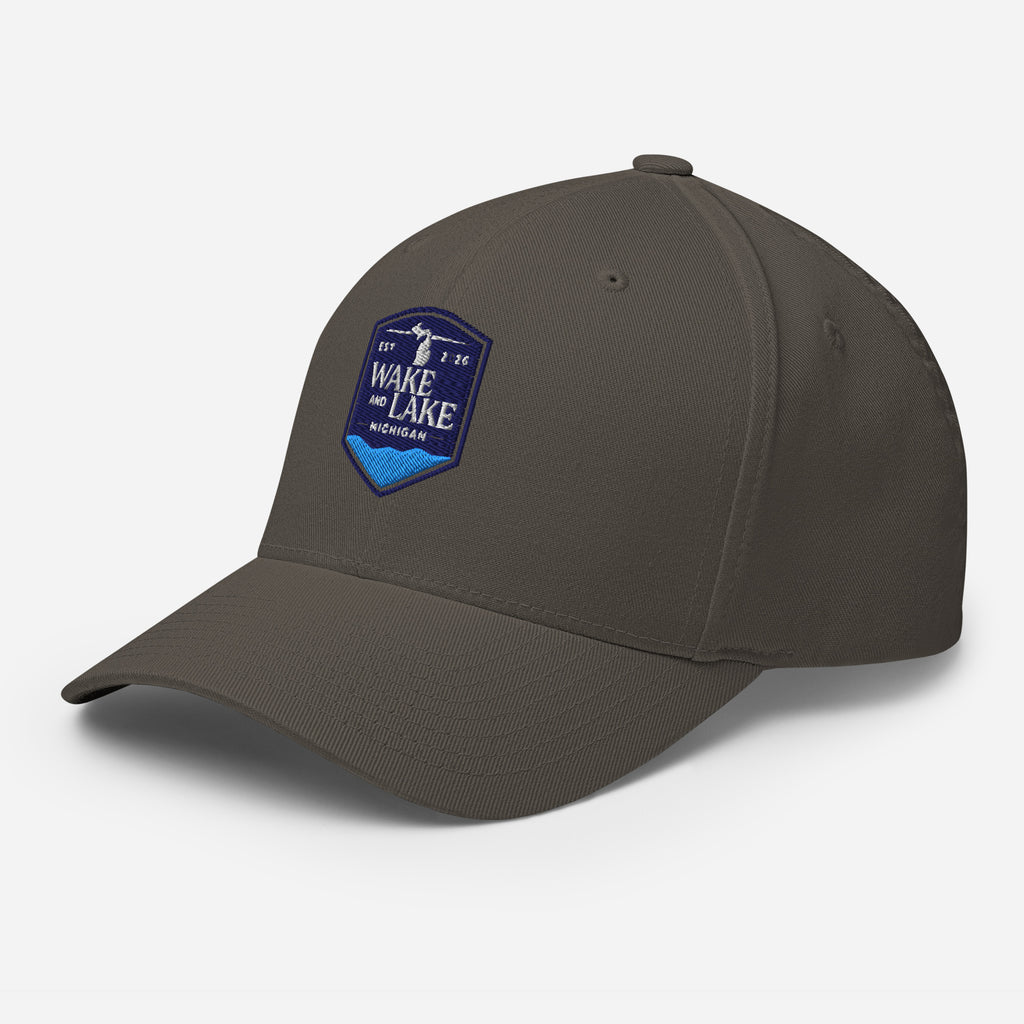 Wake and Lake Michigan Shield FlexFit Hat,  dark grey with Coordinate badge on the front, and Circle Crest logo on the back, front view
