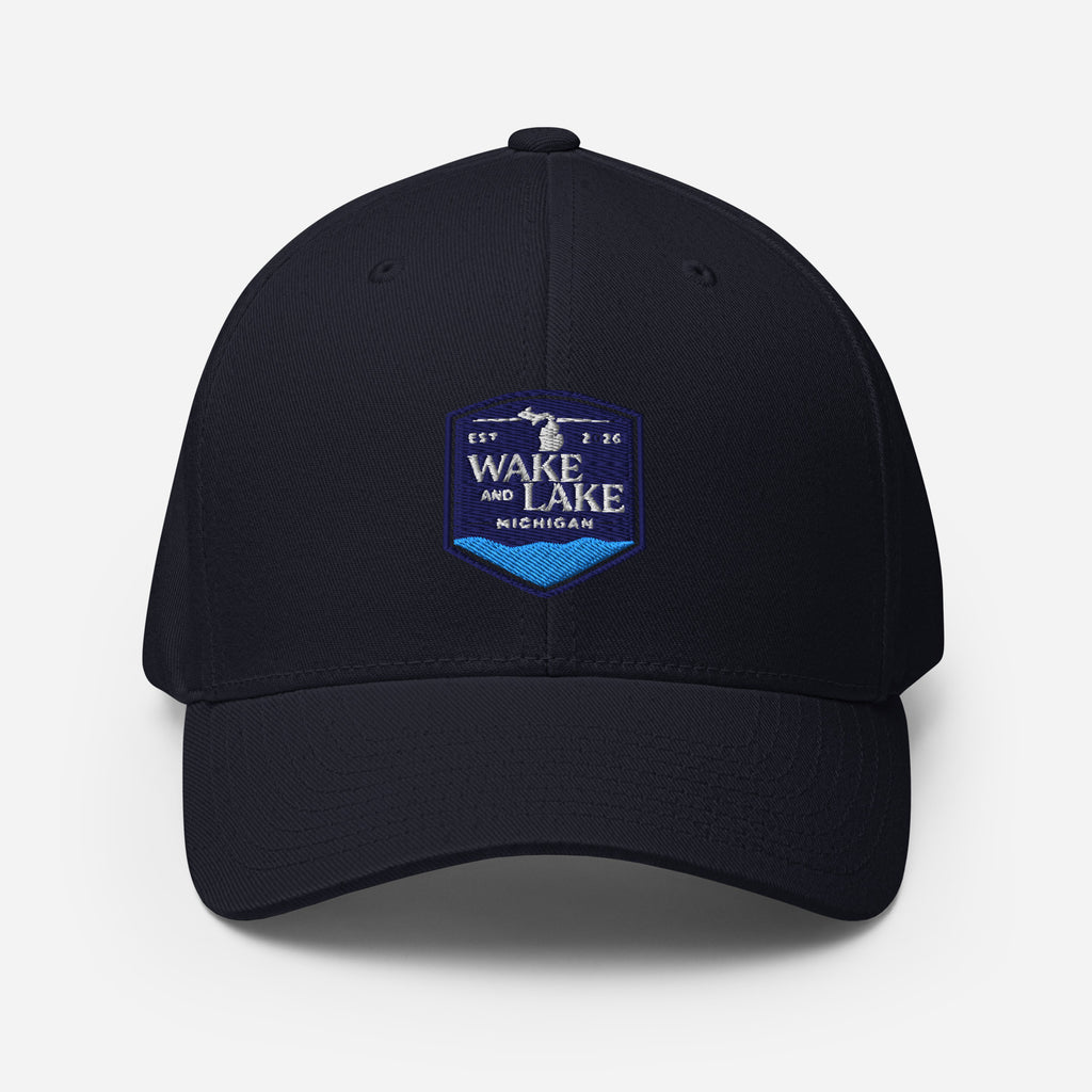 Wake and Lake Michigan Shield FlexFit Hat, Dark Navy with Coordinate badge on the front, and Circle Crest logo on the back, front view