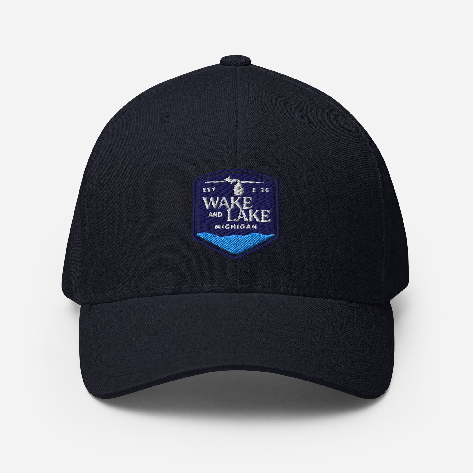 Wake and Lake Michigan Shield FlexFit Hat, Dark Navy with Coordinate badge on the front, and Circle Crest logo on the back, front view