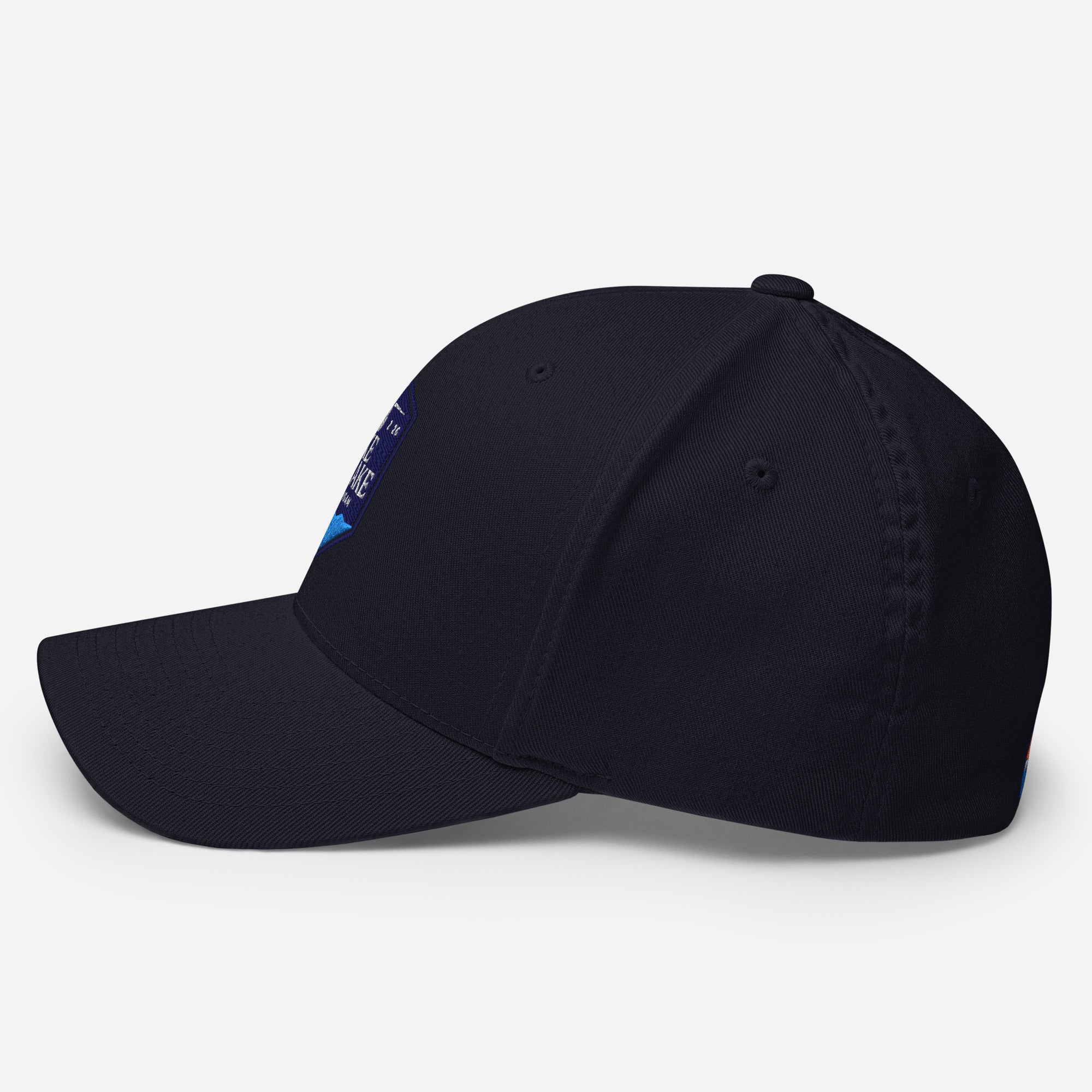 Wake and Lake Michigan Shield FlexFit Hat, Dark Navy with Coordinate badge on the front, and Circle Crest logo on the back, side view