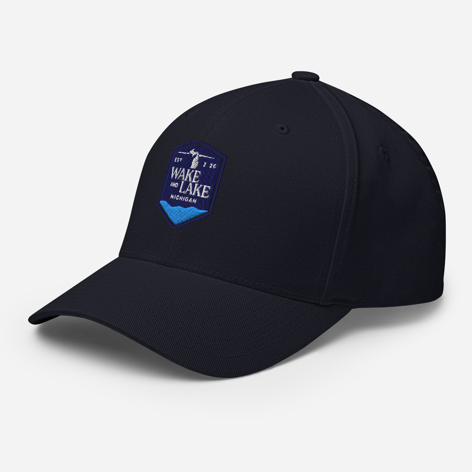Wake and Lake Michigan Shield FlexFit Hat, Dark Navy with Coordinate badge on the front, and Circle Crest logo on the back, front view