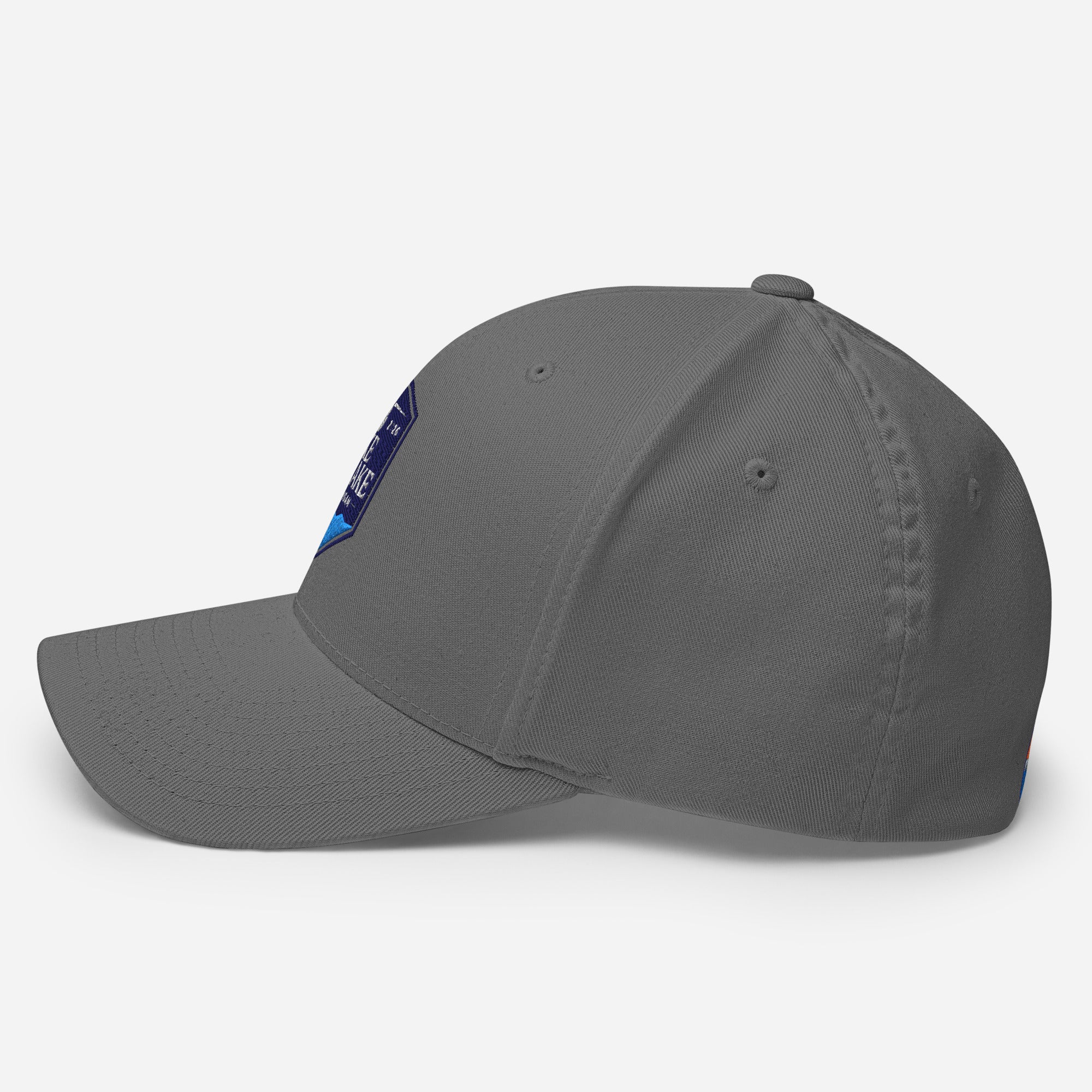 Wake and Lake Michigan Shield FlexFit Hat, grey with Coordinate badge on the front, and Circle Crest logo on the back, side view