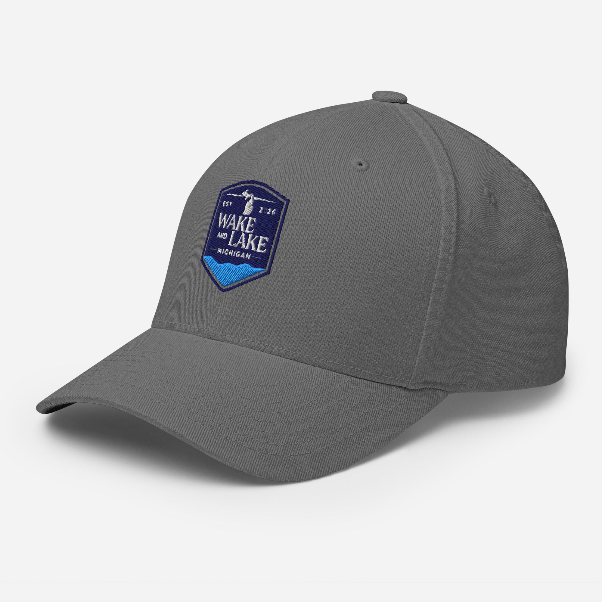 Wake and Lake Michigan Shield FlexFit Hat, grey with Coordinate badge on the front, and Circle Crest logo on the back, front view