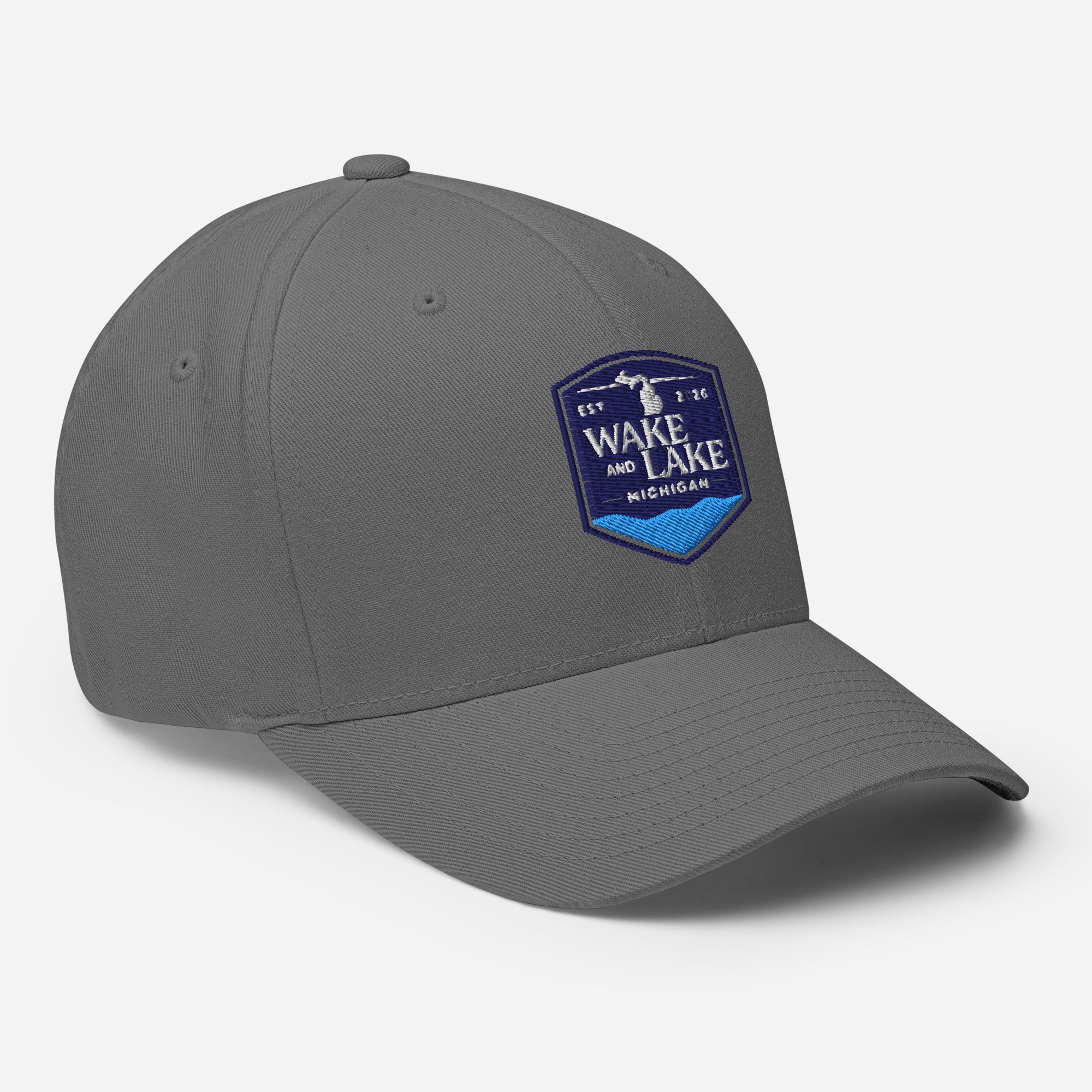 Wake and Lake Michigan Shield FlexFit Hat, grey with Coordinate badge on the front, and Circle Crest logo on the back, front view
