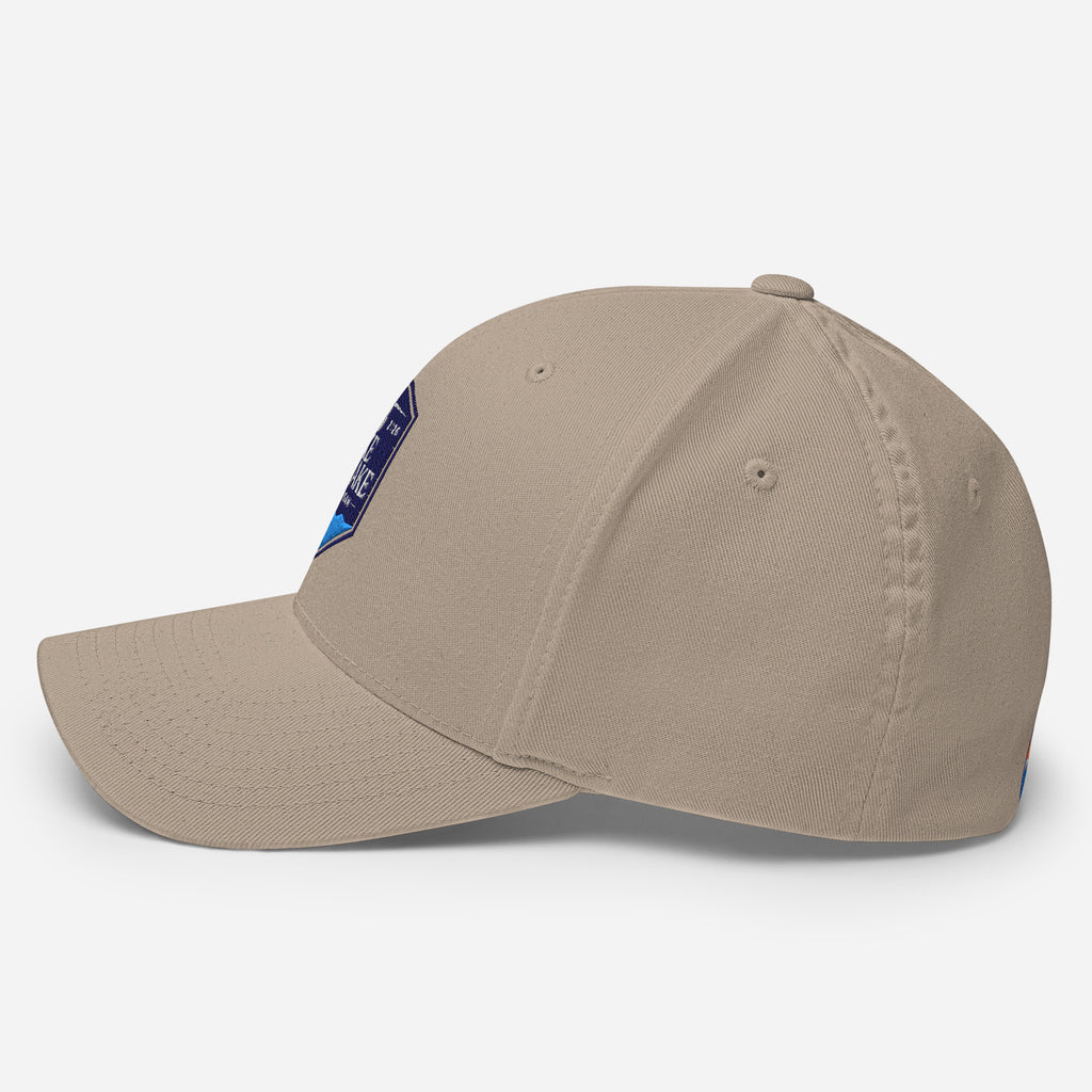Wake and Lake Michigan Shield FlexFit Hat, khaki with Coordinate badge on the front, and Circle Crest logo on the back, side view
