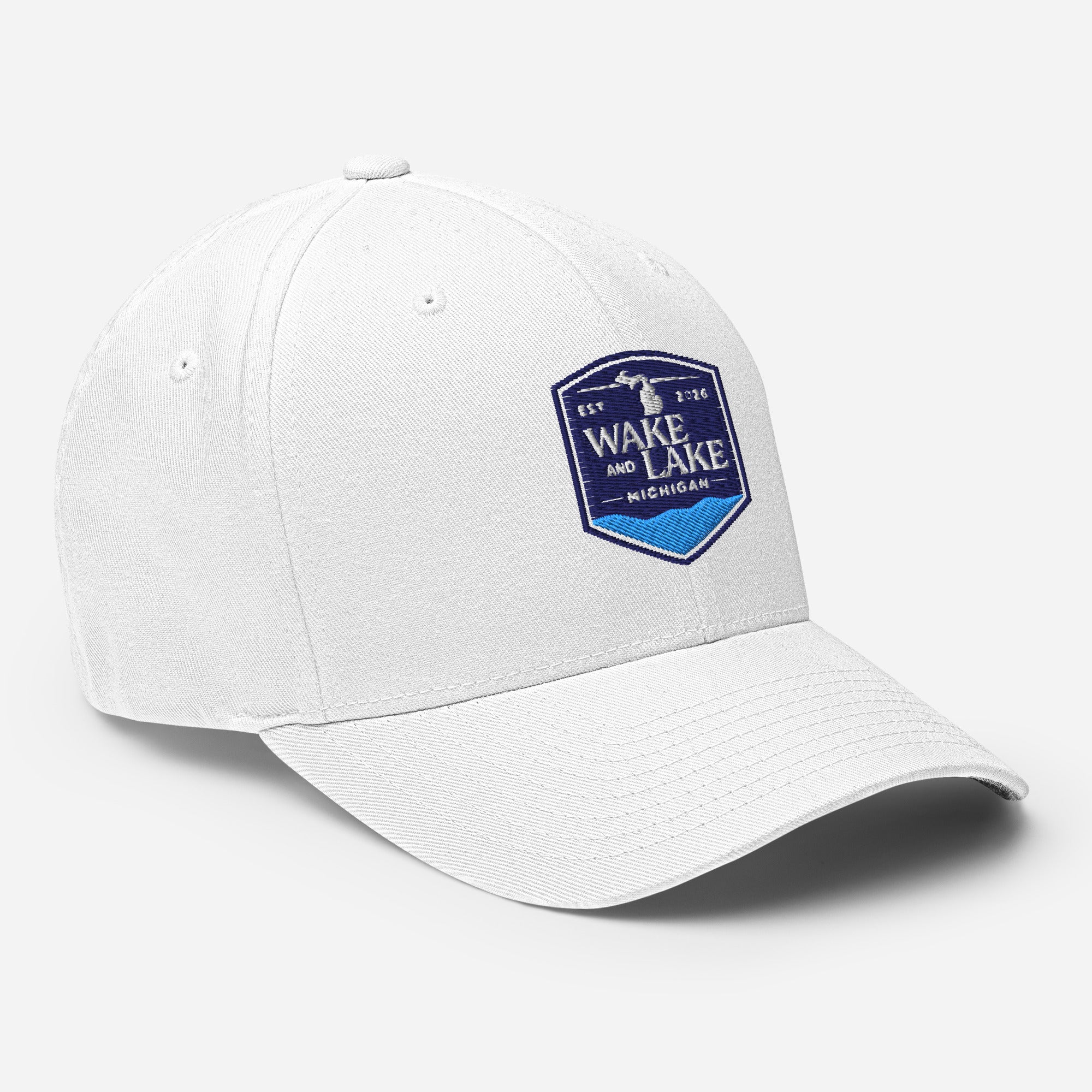 Wake and Lake Michigan Shield FlexFit Hat, White with Coordinate badge on the front, and Circle Crest logo on the back, front view